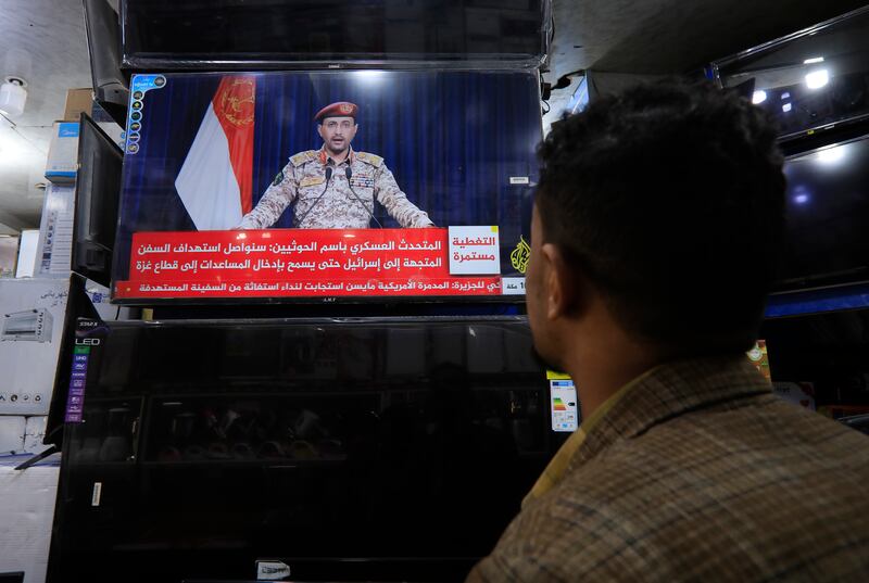 A televised statement by a Houthi military spokesman is watched in Sanaa, Yemen. The rebels' recent actions suggest they are trying to smokescreen domestic shortcomings rather than help Palestinians. EPA