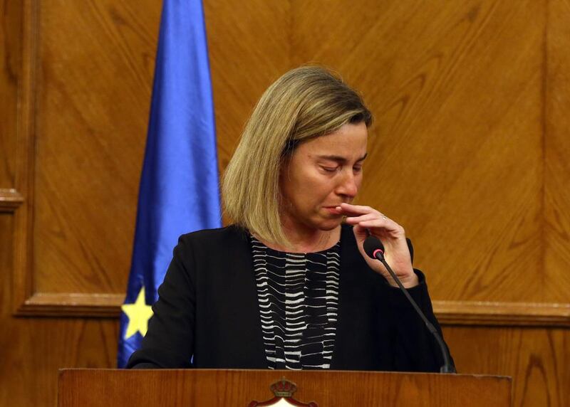 Federica Mogherini, the High Representative of the European Union for Foreign Affairs and Security Policy, cries during a joint press conference with Jordanian Foreign Minister Nasser Judeh in Amman, on hearing the news of the fatal terror attacks in Brussels. Jamal Nasrallah / EPA