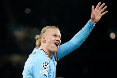 Manchester City's Erling Haaland shows five with his hand after he scored his 5th goal, the 6-0, during the Champions League round of 16 second leg soccer match between Manchester City and RB Leipzig at the Etihad stadium in Manchester, England, Tuesday, March 14, 2023.  (AP Photo / Dave Thompson)