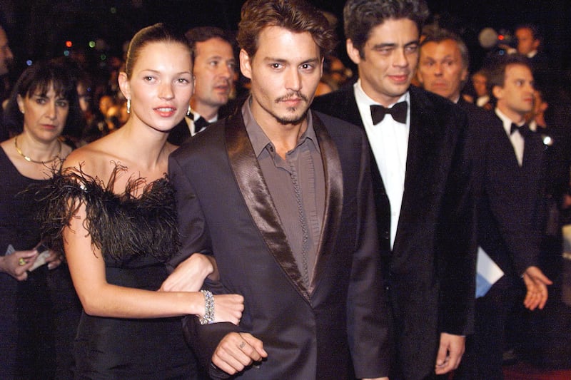 US actors Johnny Depp and Benito Del Toro with model Kate Moss at a screening of the film 'Fear and Loathing in Las Vegas' at the 51st Cannes film festival.  AFP