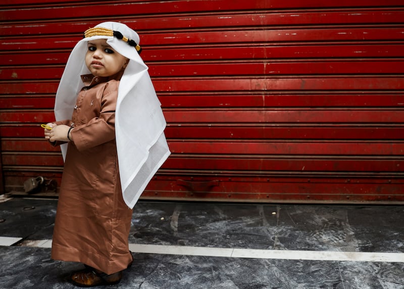 A Muslim child dressed in a thawb in the old quarters of Delhi. Reuters