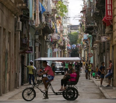 epa07606063 People is seen in a street at the Old Havana in Havana, Cuba, 27 May 2019.  EPA/Yander Zamora