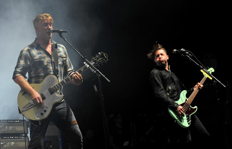 READING, ENGLAND - AUGUST 25:  Josh Homme of Queens of The Stone Age performs on stage during Day 1 of the Reading Festival at Richfield Avenue on August 25, 2017 in Reading, England.  (Photo by C Brandon/Redferns)