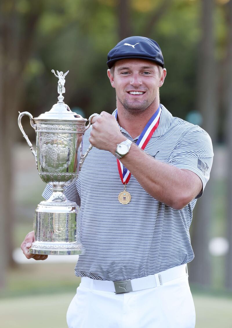 Bryson DeChambeau with the championship trophy. AFP