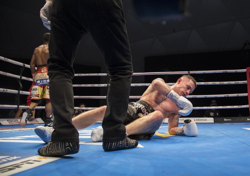 Dubai, United Arab Emirates - Carl Frampton of Northern Ireland knock off balance by Jamel Herrinng of United States  against  Jamel Herring of USA at the Rotunda, Ceasar's Palace, Bluewaters Island, Dubai.  Leslie Pable for The National