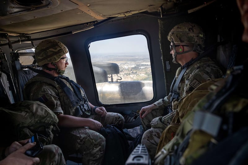 BAGHDAD, IRAQ - MAY 31: Coalition soldiers fly to Baghdad International Airport from the International Zone in a U.S. Blackhawk helicopter on May 31, 2021 in Baghdad, Iraq. Coalition forces based in Baghdad's International Zone are part of the U.S.-led Military Advisor Group of 13 nations supporting the Iraqi Security Forces.   John Moore/Getty Images/AFP
== FOR NEWSPAPERS, INTERNET, TELCOS & TELEVISION USE ONLY ==
