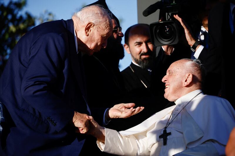 Pope Francis is greeted by religious leaders at the port city's monument to sailors and migrants lost at sea. Reuters