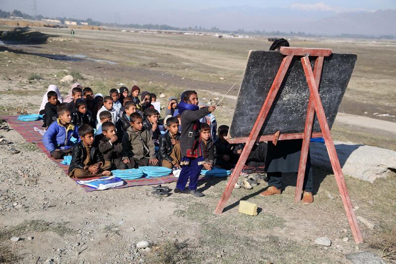 Afghan children take a class in open due to lack of school and facilities in Laghman, Afghanistan. According to reports, 39 percent of the 9.2 million students in the country are girls. However, three to five million children, mostly girls, are still unable to attend schools.  EPA
