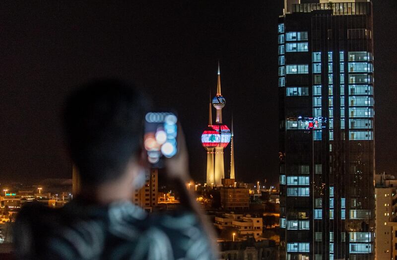 The Lebanon national flag is displayed on the Kuwait Towers as a sign of solidarity with the victims of the Beirut explosion, in Kuwait city, Kuwait. EPA