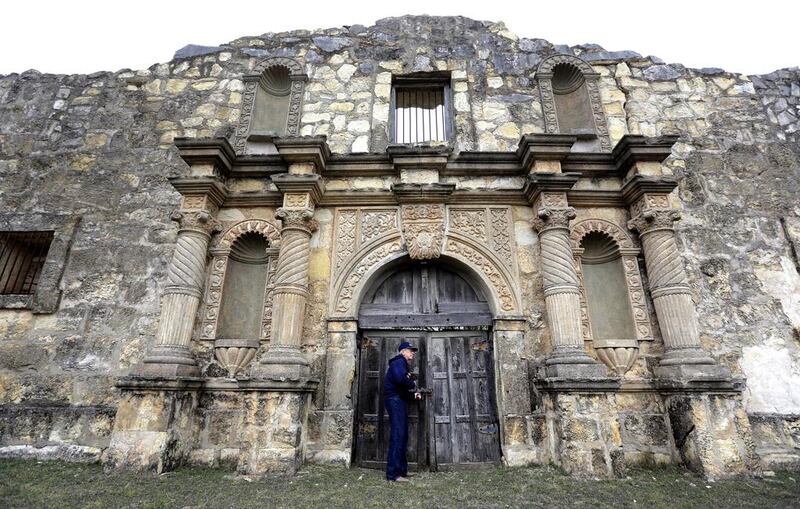 Rich Curilla locks the doors to a replica of the Alamo, built for John Wayne's 1960 movie The Alamo, near San Antonio, Texas. Eric Gay / AP Photo