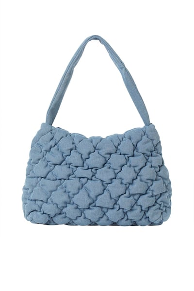 A slouchy washed denim bag from the Brock Collection X H&M. Courtesy H&M