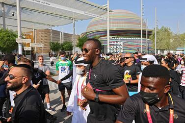 Jamaican sprinter Usain Bolt arrives for a charity run at the Expo 2020, in the Gulf emirate of Dubai, on November 13, 2021.  (Photo by Giuseppe CACACE  /  AFP)