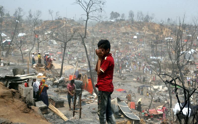 Residents of the Rohingya refugee camp in the aftermath of a huge fire in Cox's Bazar, Bangladesh. EPA