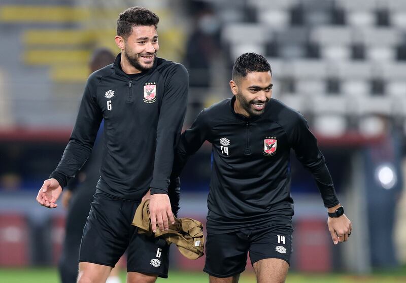 Al Ahly's Hussein El Shahat shares a joke with Yasser Ibrahim (L) during training ahead of the game against Monterrey in the Fifa Club World Cup UAE 2021 at Al Nahyan Stadium in Abu Dhabi. 