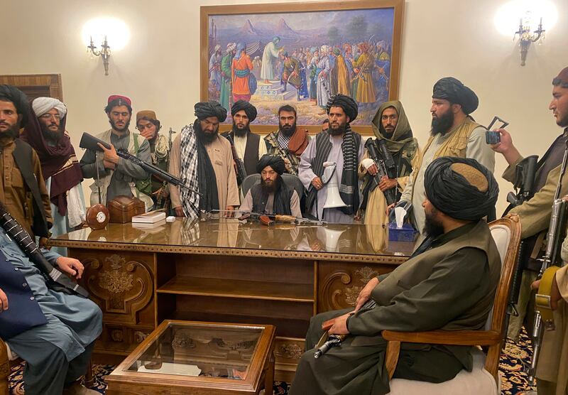 Taliban fighters take control of the Afghan presidential palace in Kabul, after the president Ashraf Ghani had fled the country, on August 15, 2021. AP