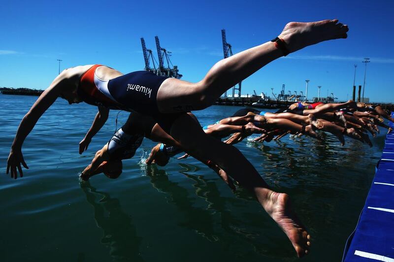 Sarissa De Vries of the Netherlands dives in for the swim leg during the ITU World Triathlon Elite Women's race on Sunday in Auckland, New Zealand. Hannah Peters / Getty Images / April 6, 2014