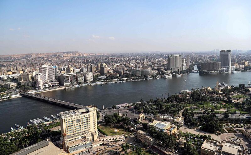 This picture taken on October 23, 2019 from the Cairo Tower in the centre of the Egyptian capital shows a view of the Nile river flowing through the city between the central downtown (background) and Zamalek districts (foreground).  / AFP / Mohamed el-Shahed
