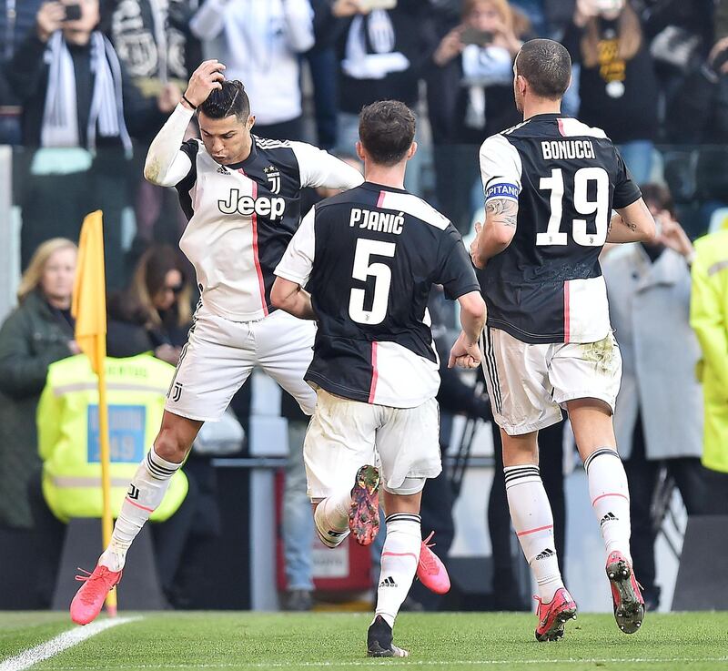 Cristiano Ronaldo celebrates with his teammates after scoring against Fiorentina at the Allianz Stadium. EPA