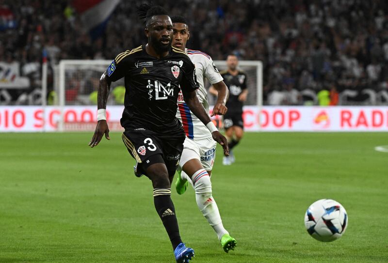 Ajaccio's Ivorian defender Ismael Diallo and Lyon's Brazilian forward Tete fight for the ball. AFP