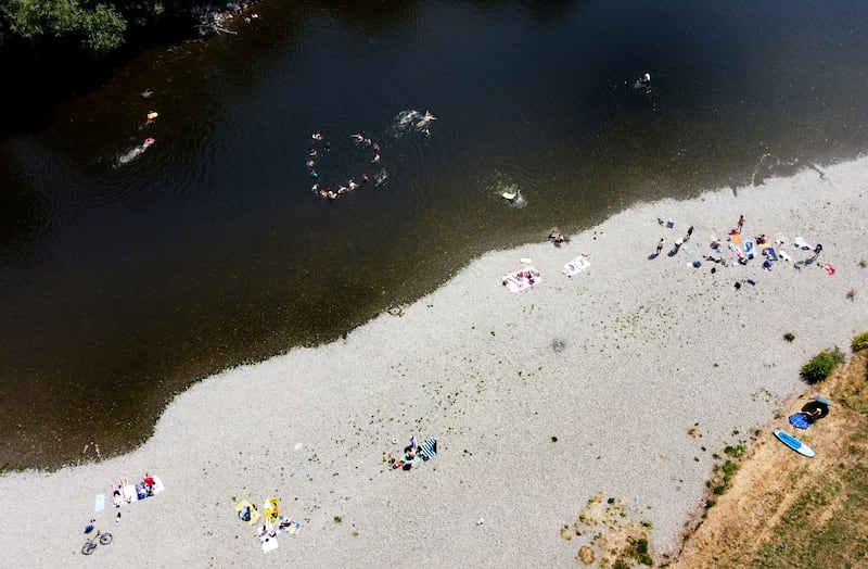 People swim in the River Wye. Reuters