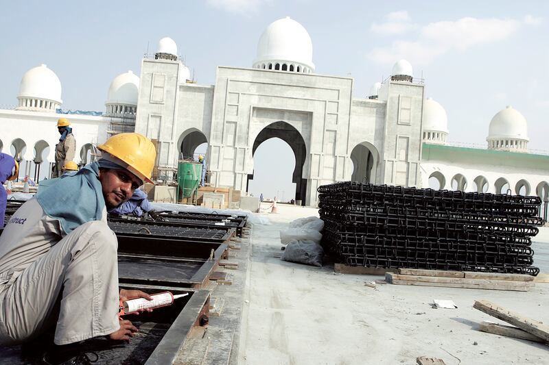 A construction worker on the site of Sheikh Zayed Grand Mosque in Abu Dhabi in December 2005. Getty