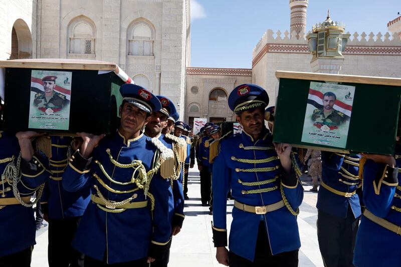epa08839196 Members of Yemeni honor guard carry the coffins of Houthi fighters who were allegedly killed in recent fighting with Saudi-backed government forces, during a funeral procession at the Al-Shaab Mosque in Sana'a, Yemen, 24 November 2020. The Saudi-led military coalition and Yemeni government forces have been fighting the Houthis since 2015, seeking to restore Yemenâ€™s internationally-recognized government to power and push back the Houthis who still hold the northern areas of Yemen, including the capital Sana'a.  EPA/YAHYA ARHAB