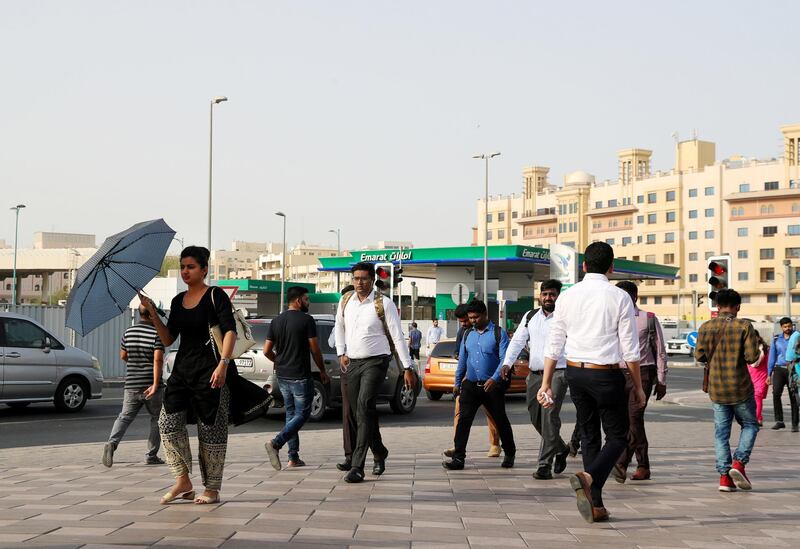 Dubai, United Arab Emirates - July 28, 2019: Stock. Early morning commuters on their way to work at Al Ghubaiba station. Sunday the 28th of July 2019. Bur Dubai, Dubai. Chris Whiteoak / The National
