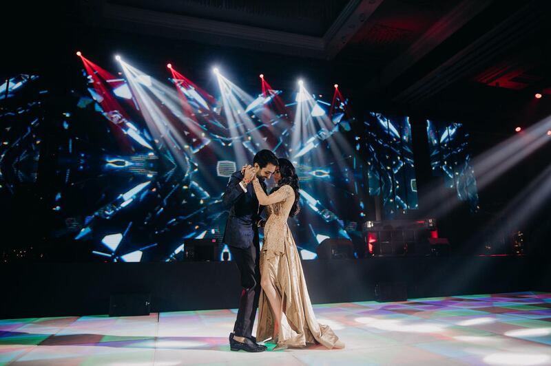 The couple share a dance.