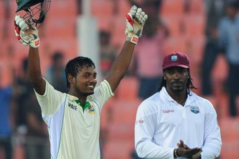 Bangladesh's Abul Hasan is applauded by Chris Gayle as he celebrates his debut century
