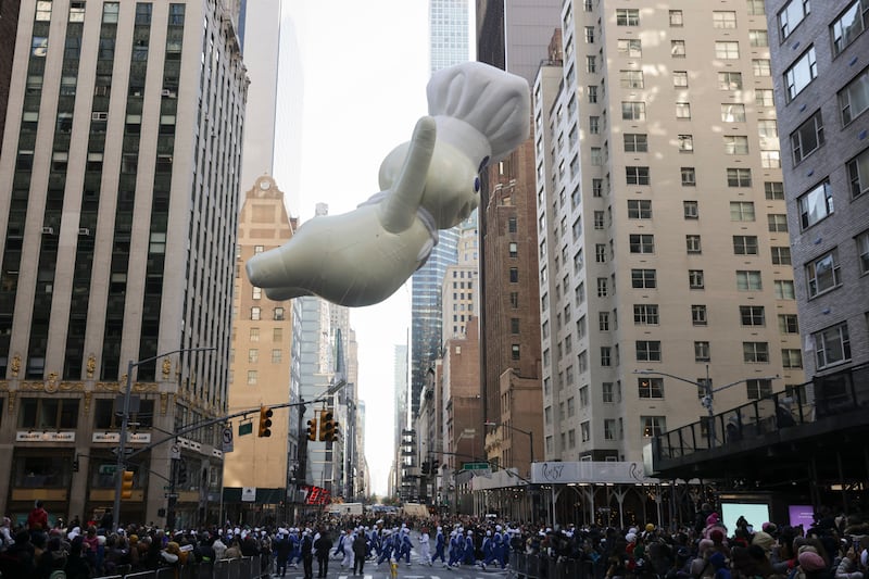 The Pillsbury Doughboy passes 57th Street. AP Photo