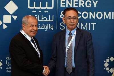 The Libyan Minister of Economy and Trade Mohamed Al Hwej (R) with global director of exploration in Repsol company Tomas Zapata (L) during the Libyan Energy and Economy Summit, in Tripoli. EPA