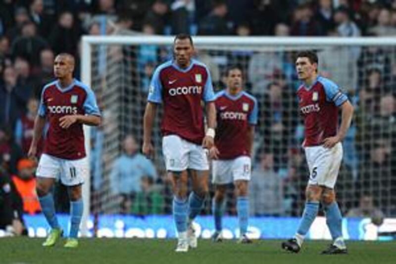 Aston Villa players, from left to right, Gabriel Agbonlahor, John Carew, Curtis Davies and Gareth Barry stand dejected after Stoke City's late rally on Sunday denied them victory in a 2-2 draw at Villa Park.