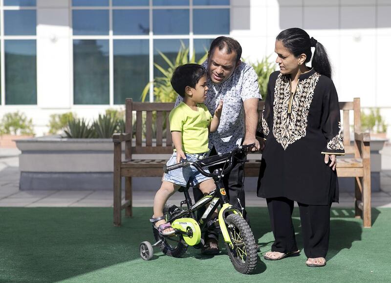 Muffadal Khumri, centre, has stunted growth, while his wife Zahra and their daughter, Zoya, suffer from dwarfism. Reem Mohammed / The National