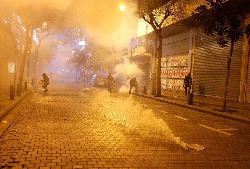 Protesters are seen amid a cloud of tear gas as protests against the economic crisis continue in Beirut, Lebanon.  Reuters