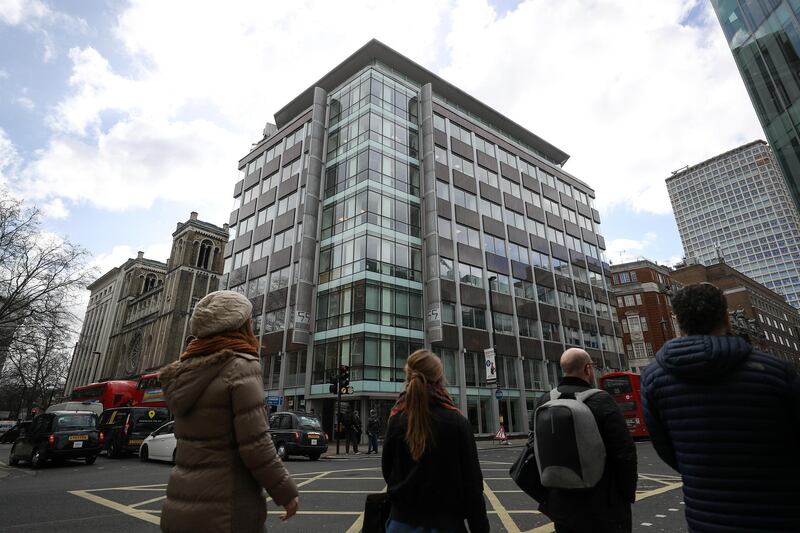 Pedestrians pass the building that houses the offices of Cambridge Analytica in London, U.K., on Tuesday, March 20, 2018. Privacy watchdogs from the U.K. and European Union are plotting their next steps in the wake of a scandal over Cambridge Analytica, who are accused of harvesting Facebook Inc. user profiles in its work for Donald Trump's presidential campaign. Photographer: Simon Dawson/Bloomberg