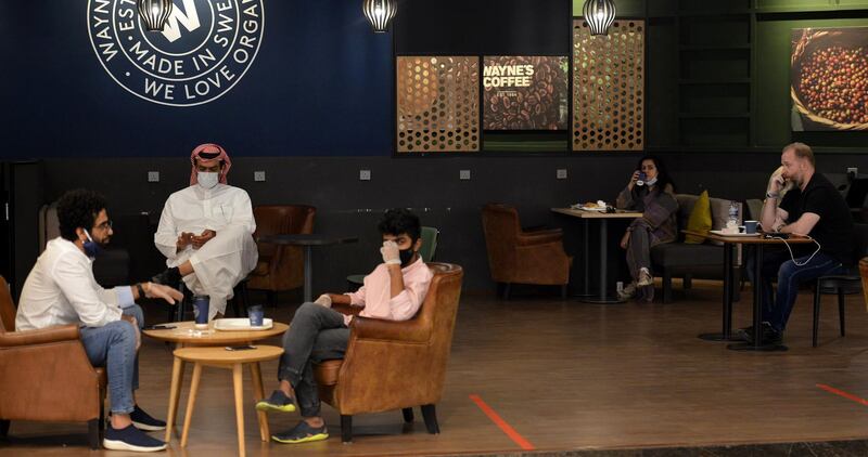 People sit at a cafe in a mall in Riyadh. AFP
