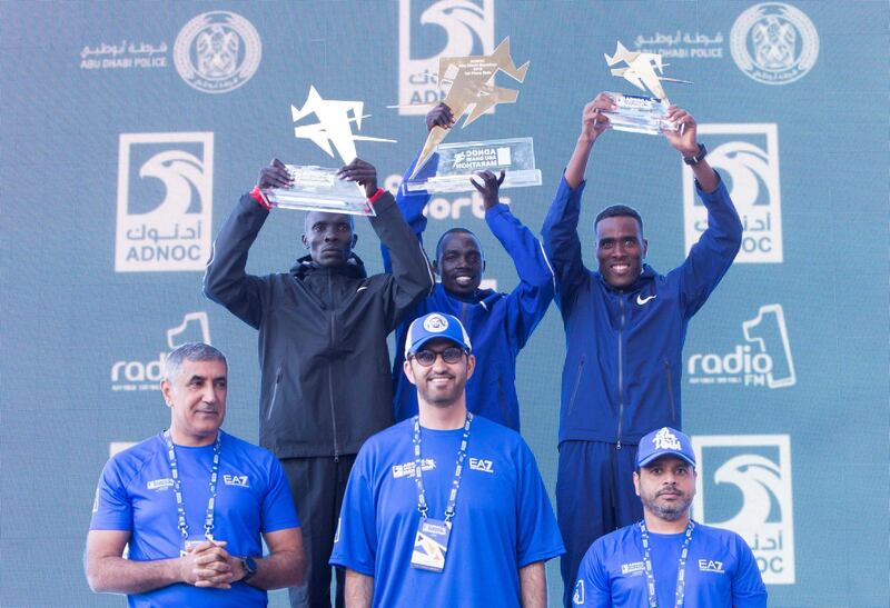 ABU DHABI, UNITED ARAB EMIRATES- Winner of the 42km women���s division with (L-R)  Kiphim (2nd), Kipserem (1st) and Gonfa (3rd) with Major General Mohammed Khalfan Al Rumaithi, Commander-In-Chief of Abu Dhabi Police, Sultan Ahmed Al Jaber is Minister of State in the United Arab Emirates, the Director-General and CEO of the Abu Dhabi National Oil Company and Dr. Salem Al Kaabi, General Manager of Tadweer at the ADNOC ABU Abu Dhabi Marathon.  Leslie Pableo for The National 