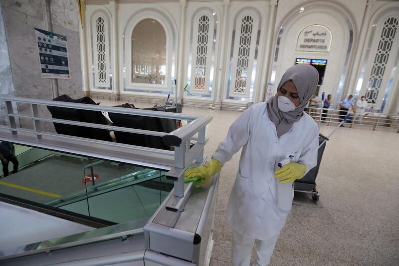 A worker disinfects surfaces at the Terminal of the Tunis Carthage International Airport in Tunis, Tunisia.  EPA