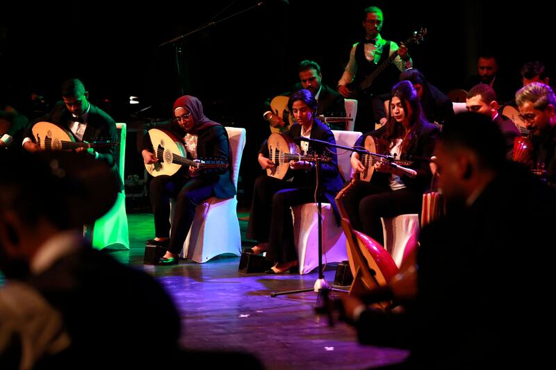 Oud players take part in a concert at Al Rasheed theatre in Baghdad