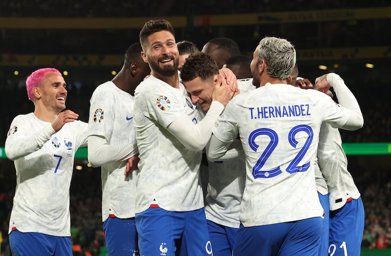 Benjamin Pavard of France (C) celebrates with teammates after scoring in the 1-0 Euro 2024 qualifier win against Ireland in Dublin on March 27, 2023. EPA