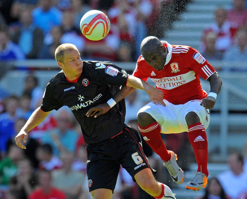 MIDDLESBROUGH, ENGLAND - AUGUST 22: Johannes Ertl (L) of Sheffield United battles Leroy Lita of Middlesbrough during the npower Championship match between Middlesbrough and Sheffield United at the Riverside Stadium on August 22, 2010 in Middlesbrough, England.  (Photo by Michael Regan/Getty Images)