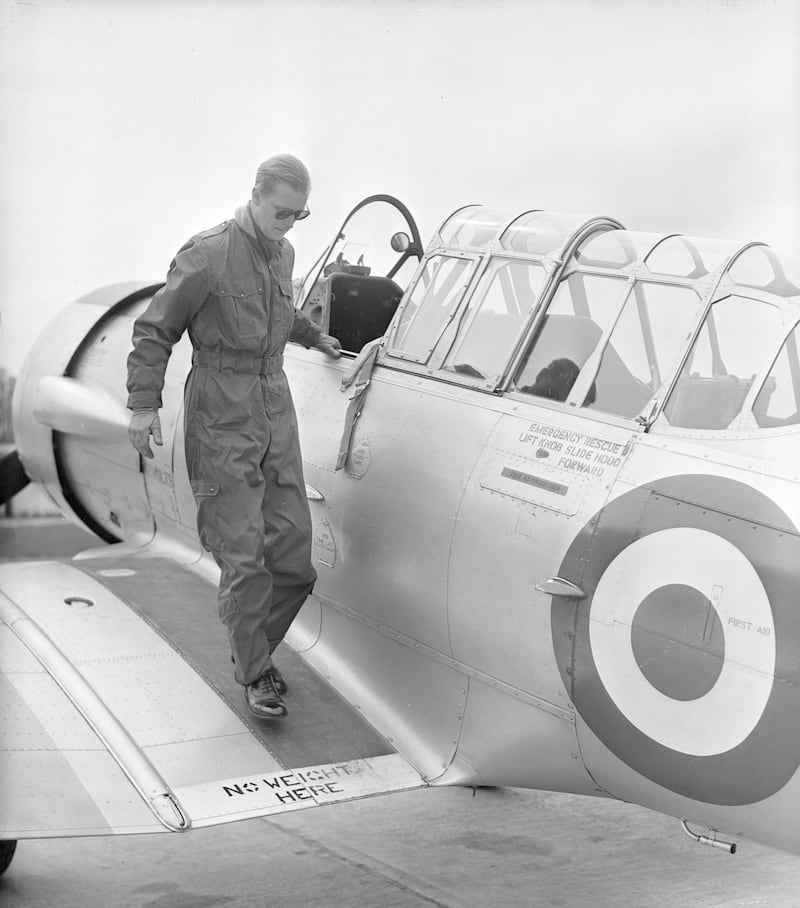 4th May 1953:  The Duke of Edinburgh disembarks from a Harvard Trainer aircraft after a flight, at RAF White Waltham, Berkshire, where he has been training for his 'wings'.  (Photo by PNA Rota/Getty Images)