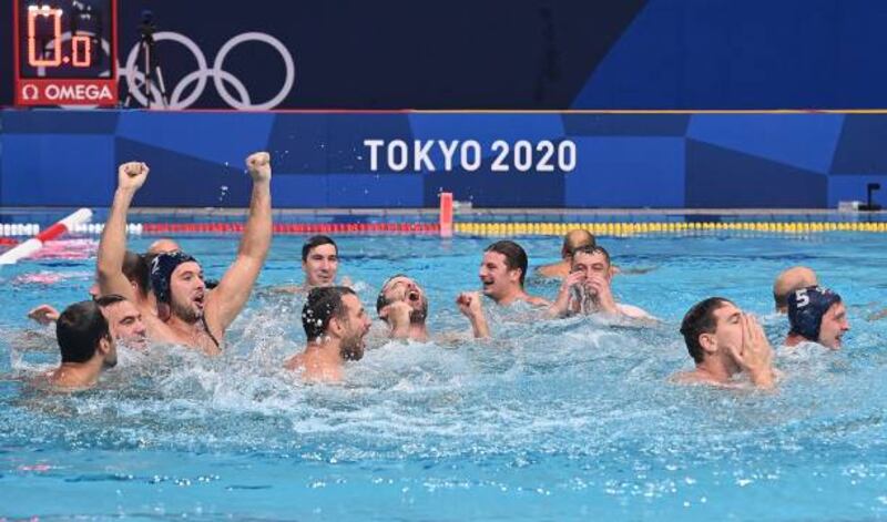 Gold medallists Serbia celebrate in the pool after winning the Tokyo 2020 Olympic Games men's water polo gold medal match against Greece.