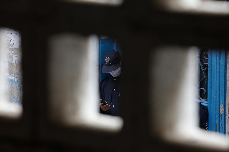 A man waits outside a food market in Algiers, on Tuesday April 21, 2020. Algerians are shopping to prepare the holy month of Ramadan which starts on Thursday in Algeria. AP Photo