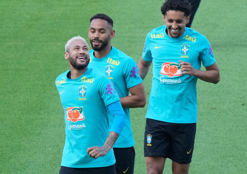 Brazil's Neymar, left, smiles during a training session at Goyang Stadium in Goyang, South Korea, Sunday, May 29, 2022.  Brazil national soccer team will play a friendly soccer match against South Korea on June 2.  (AP Photo / Ahn Young-joon)