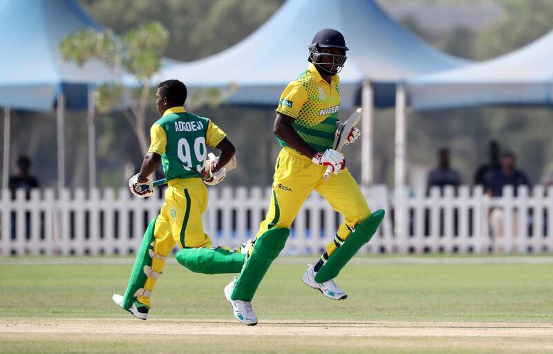 ABU DHABI , UNITED ARAB EMIRATES , October 24  – 2019 :- Sesan Adedeji ( left ) and Chimezie Nnamdi Onwuzulike ( right ) of Nigeria running between the wickets during the World Cup T20 Qualifiers between UAE vs Nigeria held at Tolerance Oval cricket ground in Abu Dhabi. UAE won the match by 5 wickets.  ( Pawan Singh / The National )  For Sports. Story by Paul