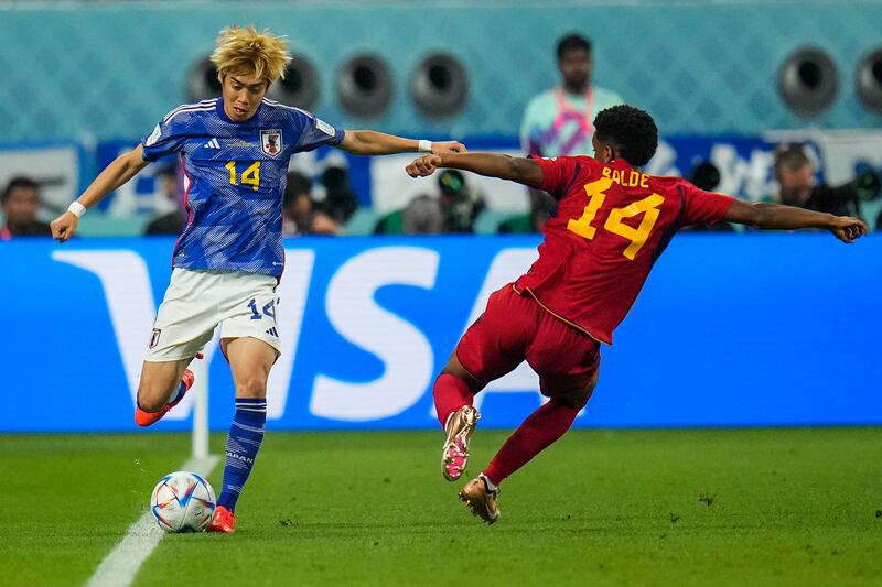 Japan's Junya Ito, left, shoots as his team try to find a way back into the tie. AP Photo