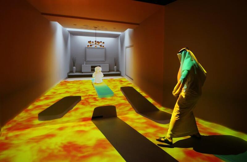 An Emirati man plays at the “Caring Machines” section of the Museum of the future during the opening day of the World Government Summit in Dubai. Kamran Jebreili / AP Photo