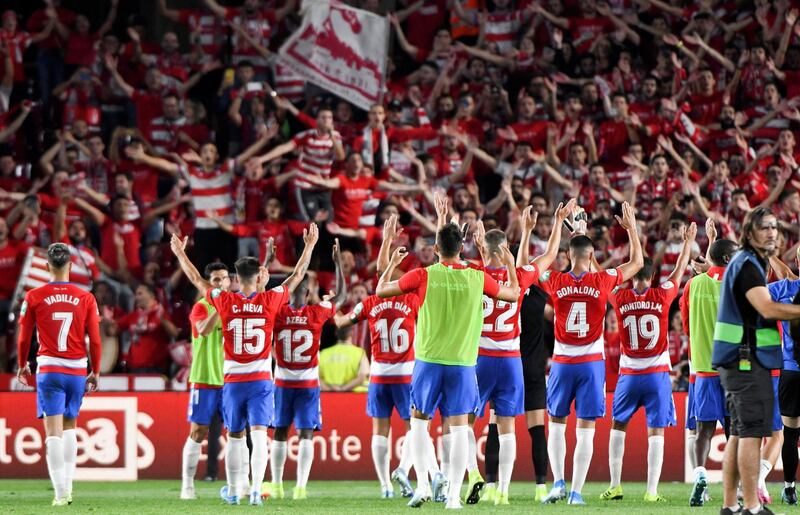 Granada players celebrate their 2-0 win over Barcelona. EPA