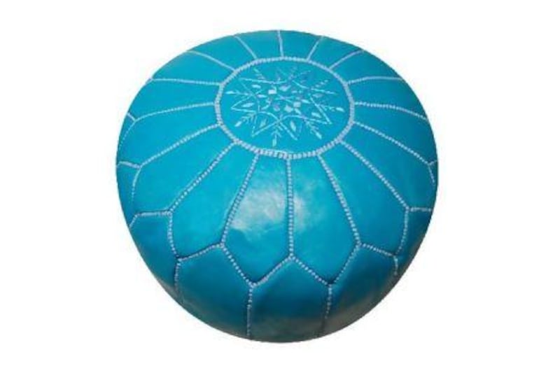 Soft leather pouffes by Jonathan Adler.